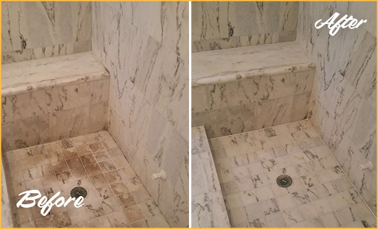 Before and After Picture of a West Samoset Marble Shower Honed to Remove Dark Stains